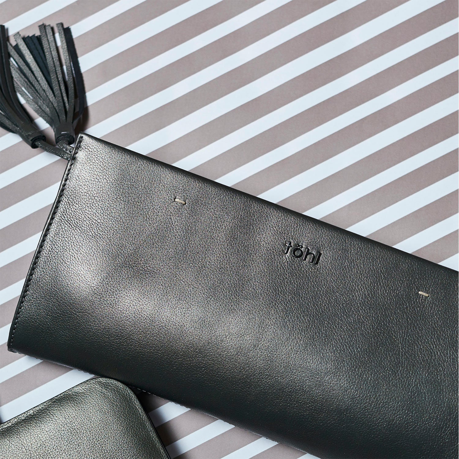 DEMI WOMEN'S TASSELLED GRIP CLUTCH - METALLIC SMOKE